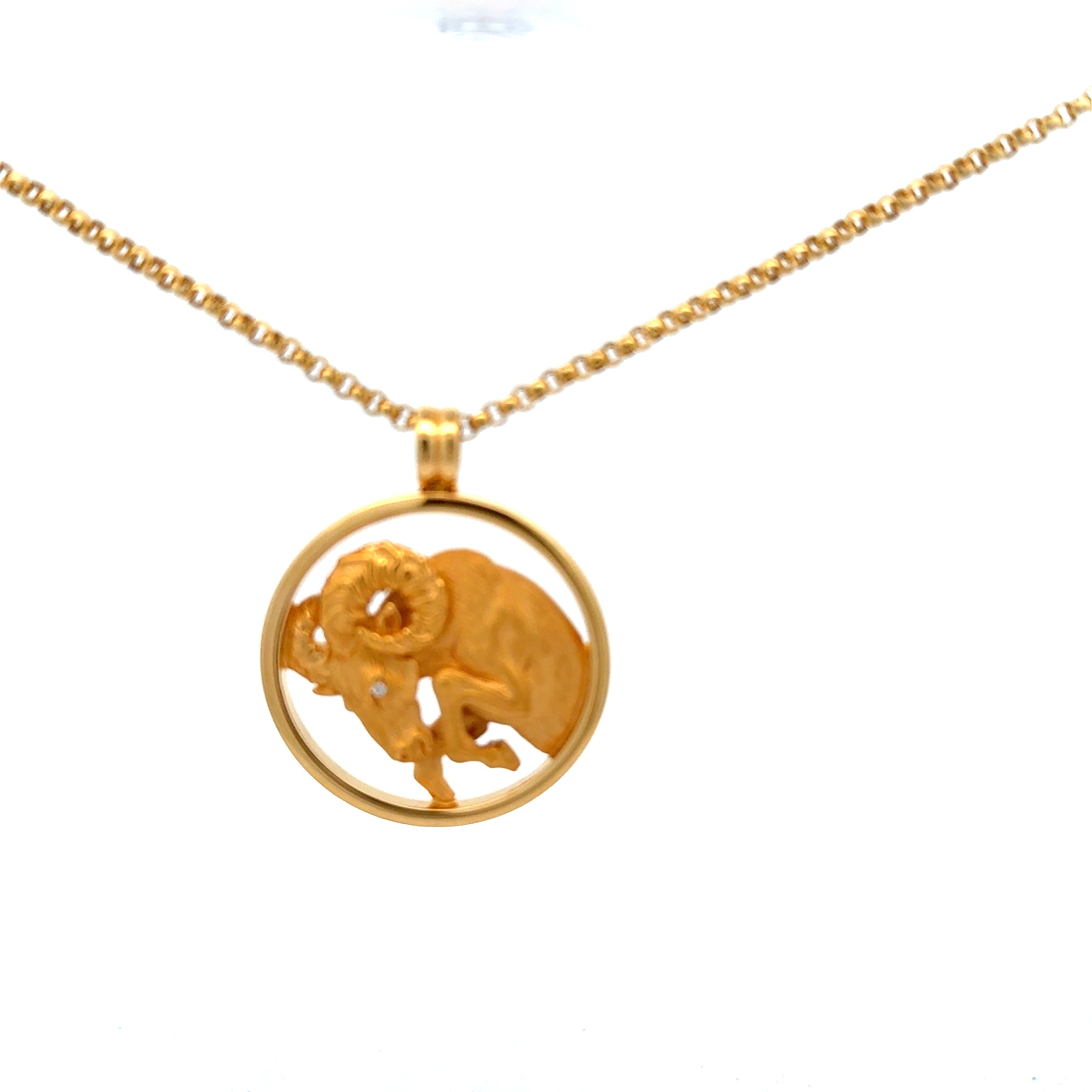 18K gold Aries zodiac pendant by Carrera with matching chain and diamond detail