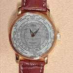 Andersen Genève 1884 Weltzeituhr in 18K Roségold mit gravierter Weltkarte