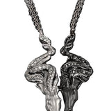 Carrera y Carrera Wild Spirit pendant necklace crafted in 18K white gold with black rhodium accents, featuring twin horse heads adorned with 125 white diamonds (1.75 ct) and 117 black diamonds (1.64 ct) on a 50 cm chain.