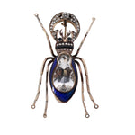 antique 14k gold insect brooch with topaz, diamonds and blue enamel on black background
