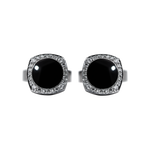 Pair of Chaumet 18K white gold cufflinks featuring polished black obsidian centers totaling 7.50 ct, surrounded by 48 brilliant-cut diamonds (0.40 ct total, E–F color, VVS clarity) in an elegant luxury design.