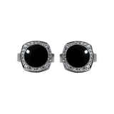 Pair of Chaumet 18K white gold cufflinks featuring polished black obsidian centers totaling 7.50 ct, surrounded by 48 brilliant-cut diamonds (0.40 ct total, E–F color, VVS clarity) in an elegant luxury design.