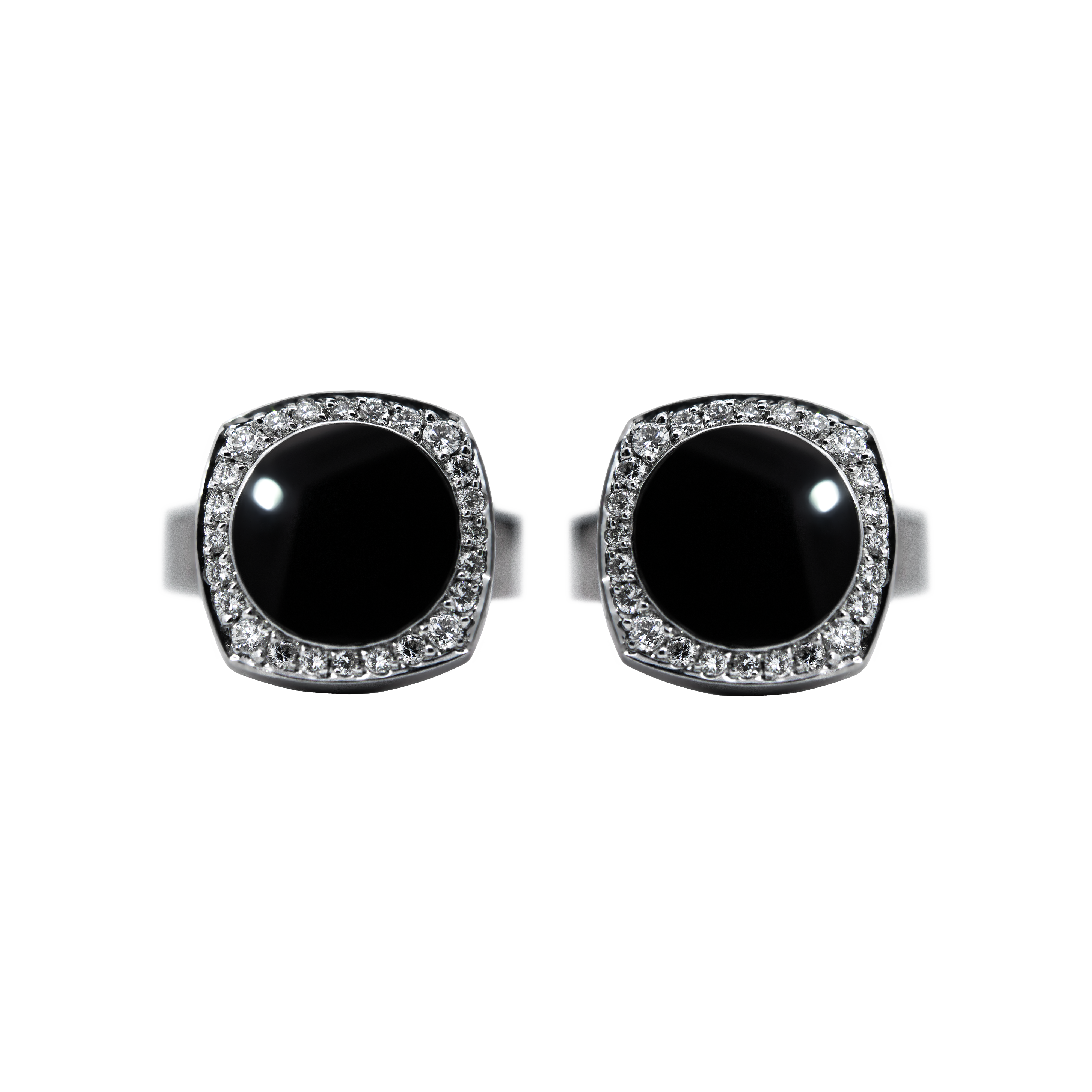 Pair of Chaumet 18K white gold cufflinks featuring polished black obsidian centers totaling 7.50 ct, surrounded by 48 brilliant-cut diamonds (0.40 ct total, E–F color, VVS clarity) in an elegant luxury design.