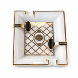 S.T. Dupont Versailles limited edition porcelain ashtray with gold detailing on white background
