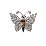 18K gold butterfly brooch with diamond wings and ruby eyes on white background, featuring spring mechanism for multi-use styling