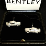 Pair of Bentley-inspired 18K white gold cufflinks shaped as classic sports cars with diamond-set wheels, presented in a luxury gift box for collectors and automotive enthusiasts.