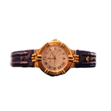 Luxury Maurice Lacroix gold ladies watch with blue strap on a woman’s wrist