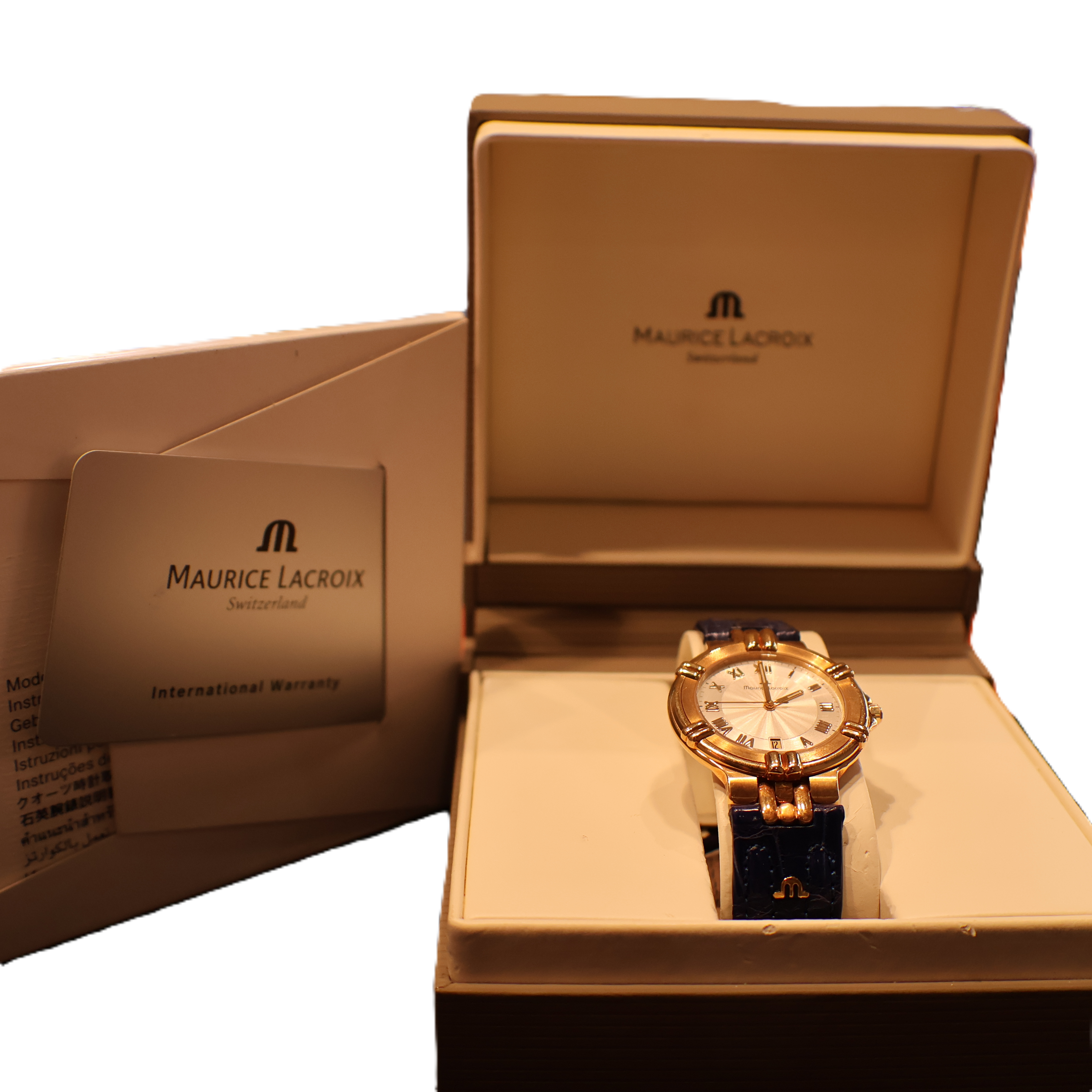 Maurice Lacroix women’s Swiss gold watch with blue leather strap worn on wrist, luxury timepiece