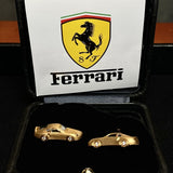 Pair of Ferrari Retro-inspired 18K yellow gold cufflinks featuring detailed classic sports car designs with brilliant-cut diamond wheels, presented in a luxury gift box for collectors and automotive enthusiasts.