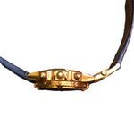 Breitling Chronomat 18K gold side profile showing crown, chronograph pushers and rider tab bezel